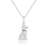 A sterling silver pendant in the shape of a poodle with a red enamel collar, attached to a silver chain.
